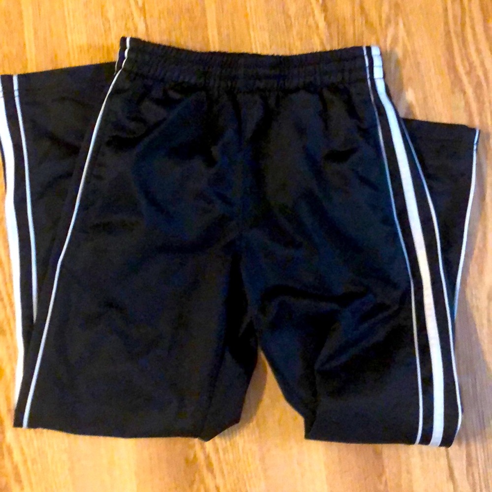 Drawstring striped sides on black pants.
